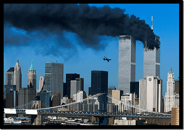 High-rise buildings in New York City during the September 11 attacks with smoke billowing from the Twin Towers.