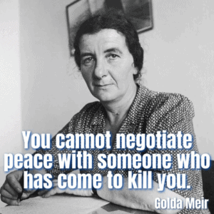 A serious woman in a polka dot sweater sitting at a desk, with the quote "You cannot negotiate peace with someone who has come to kill you" by Golda Meir overlaid.