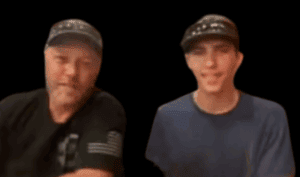 Blurry image of two men speaking passionately, representing free speech and citizen activism on One Citizen Speaking platform.