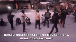 A group of individuals gathered outdoors, some standing and others crouching, with text overlay questioning whether they are Israeli collaborators or rival gang members.